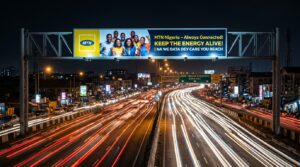 Gantry Billboard Advertising in Nigeria: Costs, Locations, and Strategy 3 Night scene of a gantry billboard illuminated above a busy highway