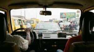 A danfo bus driver listening to radio