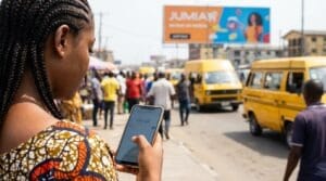A lady pressing her phone in front of a billboard
