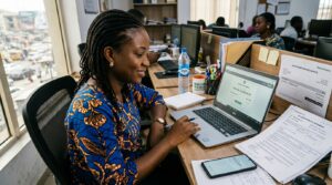 Awoman sitting at a desk in a office
