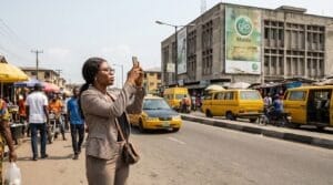 A woman snapping a Billboard location