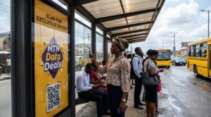 A lady scanning a QR code on an advert placement