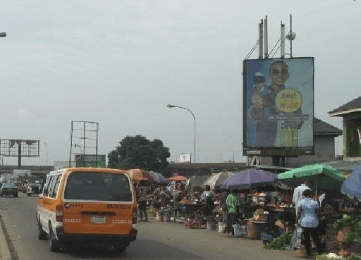 Portrait Billboard Along East–West Road by Oil Mill Market, Port Harcourt