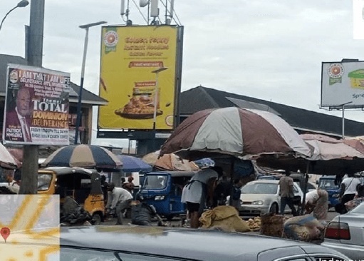 Portrait Billboard Along East–West Road by Oil Mill Market, Port Harcourt