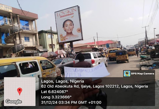 Portrait Billboard at Agege Market Road by Post Office Facing Pen Cinema Bridge, Lagos