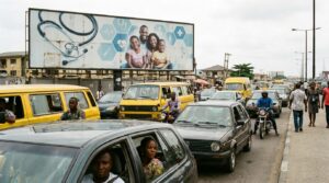 An healthcare billboard positioned along a congested commuter road