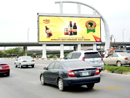 Billboard in Lagos, Oworoshoki by Berger Bus Stop Facing Third Mainland Bridge, Victoria Island and Lekki
