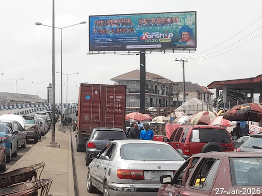 Billboard in Port Harcourt, Oluobasanjo Way by Ikoku Spare Parts Market Facing Waterlines