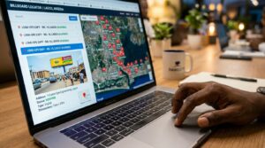 A hand scrolling through a laptop