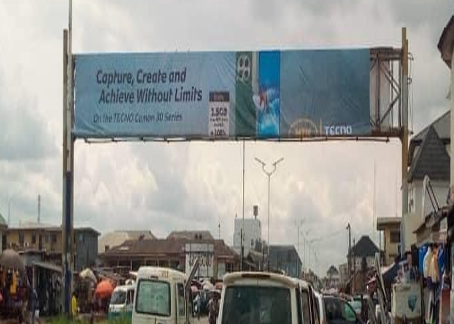 Gantry Billboard along Douglas Road by New Market FTF Emmanuel College Roundabout, Owerri, Imo State
