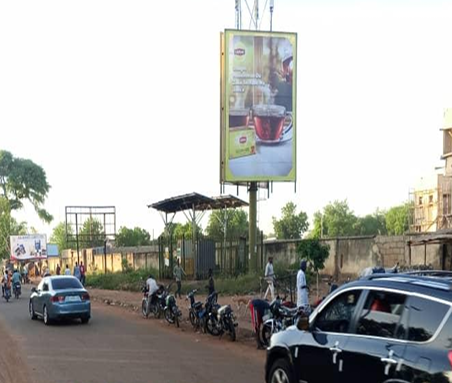 Static Billboard at Kano-Bello Fodio Roads Roundabout by Bello Road Intersection, Sokoto, Sokoto State